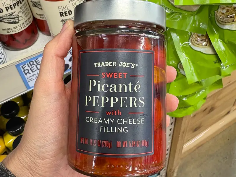 A jar of Trader Joe's sweet picanté peppers with creamy cheese filling.