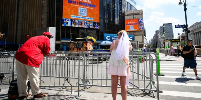 Taylor-Swift-Fans-Turn-Out-in-Small-Numbers-for-MSG.webp Taylor Swift Fans Turn Out in Small Numbers for MSG Wedding